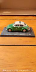 MaxSold Auction: Volkswagen Beetle Mexico City Taxi Die-Cast Model on Display Base – 1985  - Toronto (Ontario, Canada) SELLER MANAGED Moving Online Auction - 1/2  Wellesley Street East