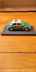 MaxSold Auction: Volkswagen Beetle Mexico City Taxi Die-Cast Model on Display Base – 1985  - Toronto (Ontario, Canada) SELLER MANAGED Moving Online Auction - 1/2  Wellesley Street East