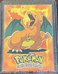 MaxSold Auction: 1999 Topps Pokémon Charizard Stage 3 Gotta Catch’em Movie Animation A1 Collectible Trading Card  - Newmarket (Ontario, Canada) PARTNER MANAGED Reseller Online Auction - Walter Avenue