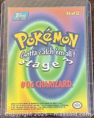 MaxSold Auction: 1999 Topps Pokémon Charizard Stage 3 Gotta Catch’em Movie Animation A1 Collectible Trading Card  - Newmarket (Ontario, Canada) PARTNER MANAGED Reseller Online Auction - Walter Avenue