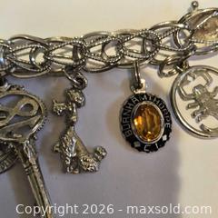 MaxSold Auction: Vintage sterling silver charm bracelet  - Caledon (Ontario, Canada) SELLER MANAGED Downsizing Online Auction - Hurontario Street