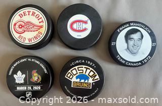 MaxSold Auction: Lot of 10 Hockey Pucks w / Game  & Commerative Pucks ++ - Ottawa (Ontario, Canada) SELLER MANAGED Downsizing Online Auction - Sandy Forest Place