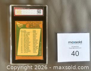 MaxSold Auction: 1978-79 OPC New York Islanders Team Checklist Card Graded KSA 4.5 VGE+ - Ottawa (Ontario, Canada) SELLER MANAGED Downsizing Online Auction - Sandy Forest Place