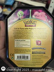 MaxSold Auction: Pokemon Tin with card holder books inside - Kingston (Ontario, Canada) SELLER MANAGED Downsizing Online Auction - Railway Street