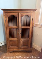 MaxSold Auction: Vintage Indonesian Teak Spindle Front Cabinet - San Francisco (California, USA) SELLER MANAGED Estate Sale Online Auction - Kenwood Way