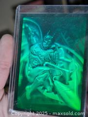 MaxSold Auction: Batman Classic TV Series Batmobile Batman Diecast, 1995 Holographic Fleer &#38; 1982 Batman Lithograph Poster (DC Comics) - Langley (British Columbia, Canada) SELLER MANAGED Reseller Online Auction - 68 Avenue