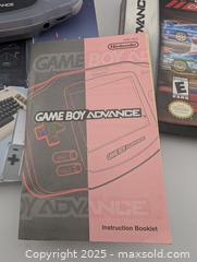 MaxSold Auction: Game Boy Advanced, 4 Game Collection, EZ Grip Holder &#38; Game Machines Encyclopedia (all working!)  - Langley (British Columbia, Canada) SELLER MANAGED Reseller Online Auction - 68 Avenue