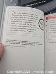 MaxSold Auction: Game Boy Advanced, 4 Game Collection, EZ Grip Holder &#38; Game Machines Encyclopedia (all working!)  - Langley (British Columbia, Canada) SELLER MANAGED Reseller Online Auction - 68 Avenue