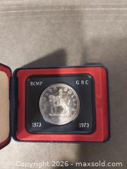 MaxSold Auction: 1973 Canada RCMP Commemorative Silver Dollar - Barrie (Ontario, Canada) SELLER MANAGED Downsizing Online Auction - Oakley Park Square