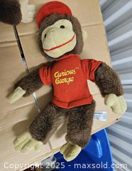 MaxSold Auction: Curious George Plush Monkey, Brown/Tan with Red Clothing -  Kingston (Ontario, Canada) PARTNER MANAGED Downsizing Online Auction - Steve Fonyo Drive  (STORAGE)