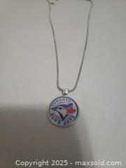 MaxSold Auction: Stainless still necklace blue jays - Ottawa (Ontario, Canada) SHORT NOTICE SELLER MANAGED Downsizing Online Auction - Van Lang Private (CONDO)