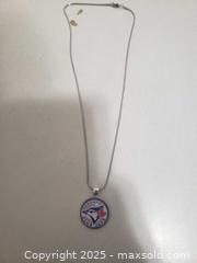 MaxSold Auction: Stainless still necklace blue jays - Ottawa (Ontario, Canada) SHORT NOTICE SELLER MANAGED Downsizing Online Auction - Van Lang Private (CONDO)