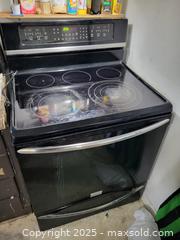 MaxSold Auction: Frigidaire Electric Freestanding Smooth-Top Range, Black/Stainless - Kingston (Ontario, Canada) SELLER MANAGED Downsizing Online Auction - Development Drive (STORAGE)