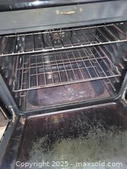 MaxSold Auction: Frigidaire Electric Freestanding Smooth-Top Range, Black/Stainless - Kingston (Ontario, Canada) SELLER MANAGED Downsizing Online Auction - Development Drive (STORAGE)