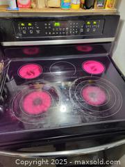 MaxSold Auction: Frigidaire Electric Freestanding Smooth-Top Range, Black/Stainless - Kingston (Ontario, Canada) SELLER MANAGED Downsizing Online Auction - Development Drive (STORAGE)