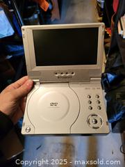 MaxSold Auction: Polaroid PDV-0700K Portable Folding 7-inch DVD Player - Kingston (Ontario, Canada) SELLER MANAGED Downsizing Online Auction - Development Drive (STORAGE)
