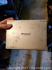 MaxSold Auction: Polaroid PDV-0700K Portable Folding 7-inch DVD Player - Kingston (Ontario, Canada) SELLER MANAGED Downsizing Online Auction - Development Drive (STORAGE)