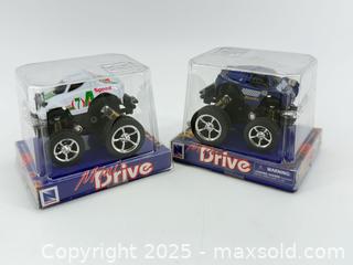 MaxSold Auction: 2 Mini Monster Trucks – Pull-Back / Friction Drive – New in Box  - Upland (California, USA) SELLER MANAGED Reseller Online Auction - Monte Vista