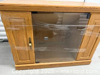 MaxSold Auction: corner TV stand in an oak finish with a glass door and two side cabinet - Toronto (Ontario, Canada) SELLER MANAGED Downsizing Online Auction - Jane Street (STORAGE)