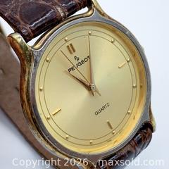 MaxSold Auction: 31.5mm Peugeot Quartz Gold-Plated Watch  - Vancouver (British Columbia, Canada) SELLER MANAGED Downsizing Online Auction - W20th Avenue (CONDO)