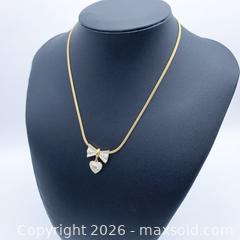 MaxSold Auction: Mario Valentino Gold Plated Bow Pendant Necklace 16-inch - Vancouver (British Columbia, Canada) SELLER MANAGED Downsizing Online Auction - W20th Avenue (CONDO)