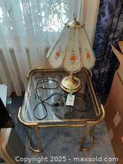 MaxSold Auction: 1970s Hollywood Regency brass and smoked glass side table and floral touch lamp - London (Ontario, Canada) PARTNER MANAGED Estate Sale Online Auction - Alayne Crescent