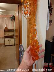 MaxSold Auction: Amber-colored crystal or glass beaded curtain for doorway - London (Ontario, Canada) PARTNER MANAGED Estate Sale Online Auction - Alayne Crescent