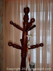 MaxSold Auction: Freestanding wooden coat rack in a cherry finish - London (Ontario, Canada) PARTNER MANAGED Estate Sale Online Auction - Alayne Crescent