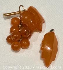 MaxSold Auction: (2) Vintage Signed Russian Amber Brooches  - Toronto (Ontario, Canada) PARTNER MANAGED Reseller Online Auction - Queen Street West