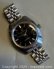 MaxSold Auction: Vintage Orient Date Automatic Watch in Working Condition  - Toronto (Ontario, Canada) PARTNER MANAGED Reseller Online Auction - Queen Street West