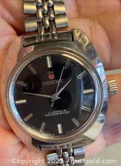 MaxSold Auction: Vintage Orient Date Automatic Watch in Working Condition  - Toronto (Ontario, Canada) PARTNER MANAGED Reseller Online Auction - Queen Street West