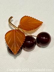 MaxSold Auction: Vintage Signed Russian Amber Cherry Brooch - Toronto (Ontario, Canada) PARTNER MANAGED Reseller Online Auction - Queen Street West