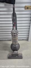 MaxSold Auction: Dyson DC77 Upright Ball Corded Vacuum (Gunmetal/Red) - Markham (Ontario, Canada) PARTNER MANAGED Downsizing Online Auction - Mccowan Road (STORAGE)