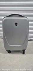MaxSold Auction: Heys Silver Hardside Carry-On Spinner Approx. 22–23 in - Markham (Ontario, Canada) PARTNER MANAGED Downsizing Online Auction - Mccowan Road (STORAGE)