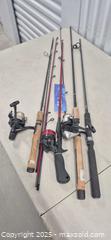 MaxSold Auction: Lot of 4 Fishing Rods with Spinning Reels - Markham (Ontario, Canada) PARTNER MANAGED Downsizing Online Auction - Mccowan Road (STORAGE)