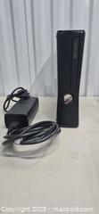 MaxSold Auction: Microsoft Xbox 360 Slim (S) Black Console - Markham (Ontario, Canada) PARTNER MANAGED Downsizing Online Auction - Mccowan Road (STORAGE)