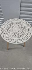 MaxSold Auction: Round 24" Carved White Accent Table with Natural Wood Legs - Markham (Ontario, Canada) PARTNER MANAGED Downsizing Online Auction - Mccowan Road (STORAGE)