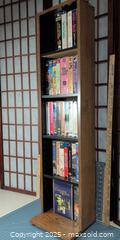 MaxSold Auction: Lot of ~34 VHS Tapes with Oak-Look Vertical Storage Shelf - Warwick (Rhode Island, USA) SELLER MANAGED Reseller Online Auction - Warwick Avenue
