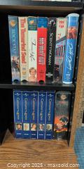 MaxSold Auction: Lot of ~34 VHS Tapes with Oak-Look Vertical Storage Shelf - Warwick (Rhode Island, USA) SELLER MANAGED Reseller Online Auction - Warwick Avenue