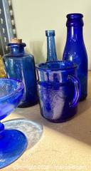MaxSold Auction: Lot of 6 Decorative Glass Bottles, Light & Cobalt Blue - Warwick (Rhode Island, USA) SELLER MANAGED Reseller Online Auction - Warwick Avenue