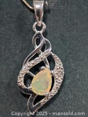 MaxSold Auction: Silver(2.19g)Opal Pendant  - Toronto (Ontario, Canada) PARTNER MANAGED Downsizing Online Auction - Queen Street East
