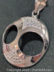 MaxSold Auction: Silver(2.61g)CZ Pendant  - Toronto (Ontario, Canada) PARTNER MANAGED Downsizing Online Auction - Queen Street East