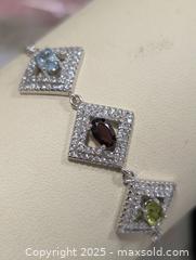 MaxSold Auction: Silver(6.22g)Garnet,Topaz,Peridot(1.5ct) - Toronto (Ontario, Canada) PARTNER MANAGED Downsizing Online Auction - Queen Street East