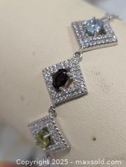 MaxSold Auction: Silver(6.22g)Garnet,Topaz,Peridot(1.5ct) - Toronto (Ontario, Canada) PARTNER MANAGED Downsizing Online Auction - Queen Street East