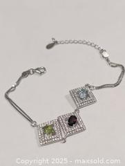 MaxSold Auction: Silver(6.22g)Garnet,Topaz,Peridot(1.5ct) - Toronto (Ontario, Canada) PARTNER MANAGED Downsizing Online Auction - Queen Street East