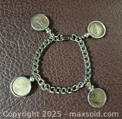 MaxSold Auction: Silver Canadian Coins Bracelet  - Toronto (Ontario, Canada) PARTNER MANAGED Reseller Online Auction - Queen Street West