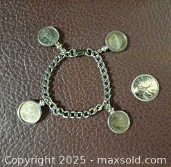 MaxSold Auction: Silver Canadian Coins Bracelet  - Toronto (Ontario, Canada) PARTNER MANAGED Reseller Online Auction - Queen Street West