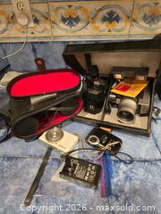 MaxSold Auction: Mixed Lot: Compact Digital Cameras, 8mm movie camera and Cinekon 10x50 Binoculars - Ashland (Massachusetts, USA) PARTNER MANAGED Downsizing Online Auction - Old Connecticut Path