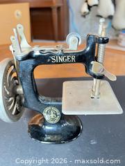 MaxSold Auction: Singer Miniature Hand-Crank Tabletop Sewing Machine - Ashland (Massachusetts, USA) PARTNER MANAGED Downsizing Online Auction - Old Connecticut Path