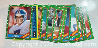 MaxSold Auction: 1986 Topps Football Card Team Set Denver Broncos includes John Elway, Karl Mecklenburg RC, Dennis Smith RC, Vance Johnson RC - Parker (Colorado, USA) SELLER MANAGED Commercial Liquidation Online Auction - Heritage Oak Drive